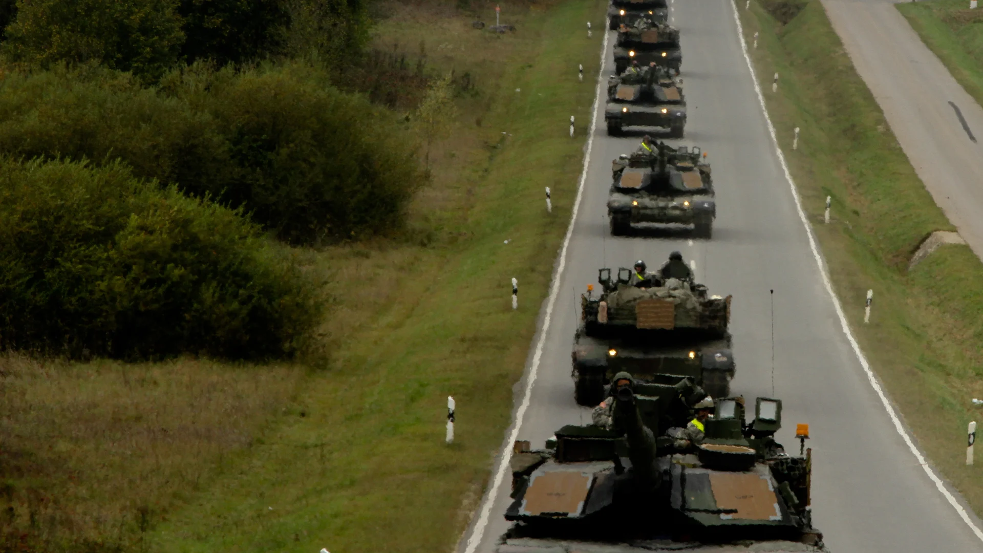 M1A2 Abrams tanks moving in convoy through the German countryside during an exercise